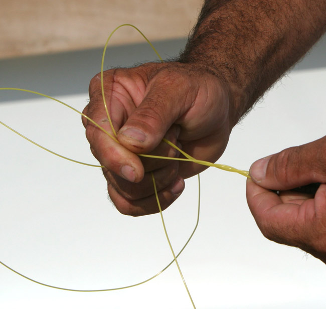 Next, take the double line and wrap 4 times around the double main line from bottom to top