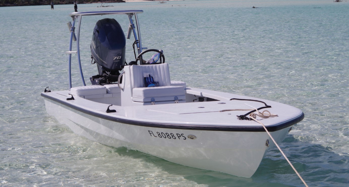 hells bay skiff floating in shallow water