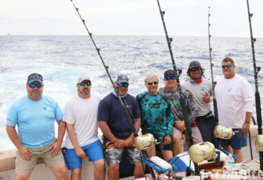 guys on back of boat