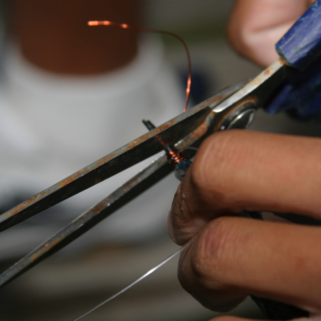 15. Take a pair of scissors and cut the ballyhoo bill and copper wire just in front of your wraps.