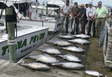 The crew of the Tuna Fever with fish.