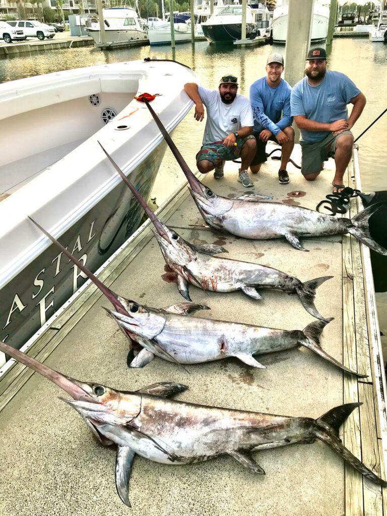 (L to R): Capt. Jackson David of Intracoastal Angler, Capt. Ben Morris of Southern Run Charters and mate Mike Accattato after a great day of swordfishing off Wrightsville Beach, NC. Multiple-fish days are common when conditions are right. Photo: Capt. Ben Morris
