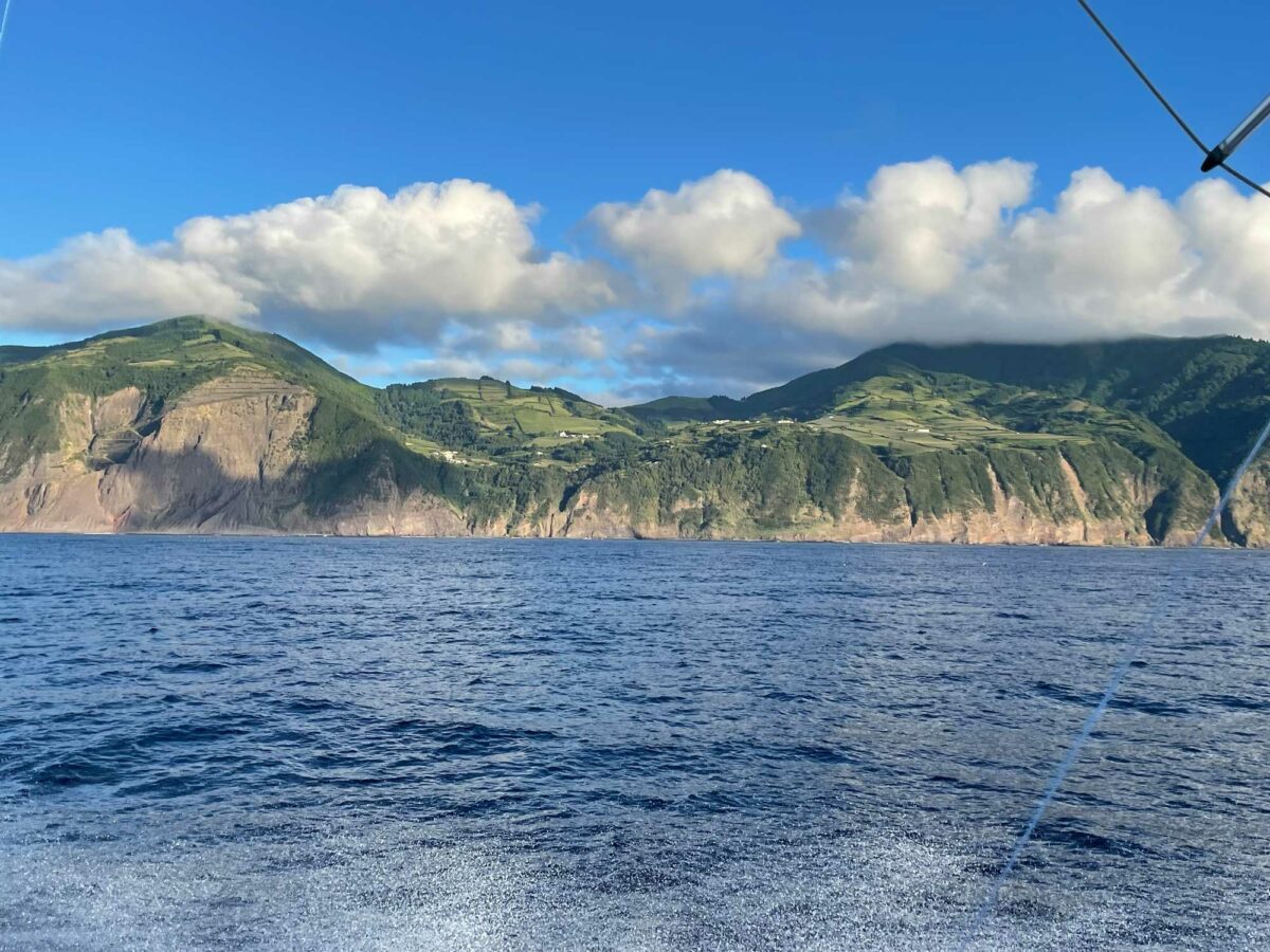 "The countryside of the island." Photo of cliffs on an island from the perspective of a boat.