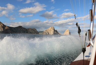 Photo of water splashing off the hull of a boat as it cuts thought he water