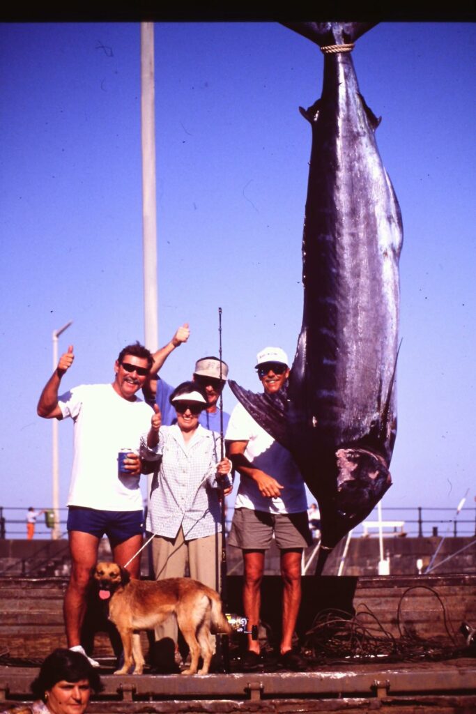 Nickie Campbell (second from left), with her 708-pound Atlantic blue marlin, caught off Madeira, Portugal, on June 28, 1996, which earned her the 30-pound blue marlin world record. With Campbell are (L to R), Capt. Bark Garnsey, Charles Perry and Spencer Stratton. Photo: Charles Perry