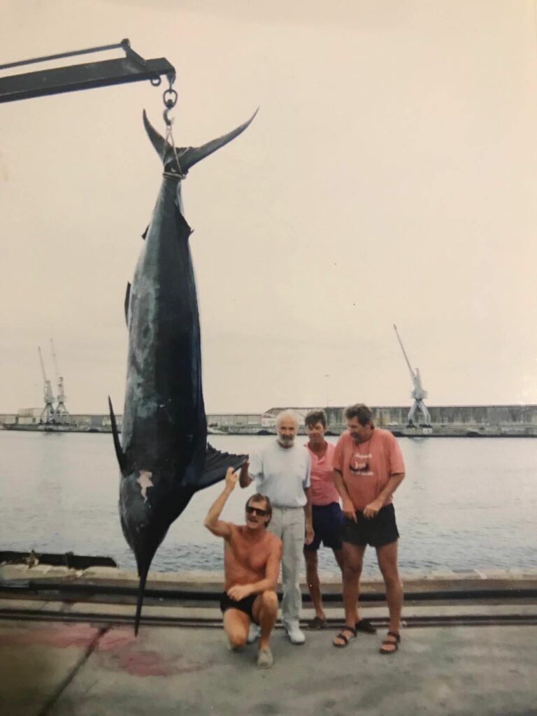 Stewart Campbell, with Charles Perry, Capt. Bark Garnsey (kneeling, right) and Garnsey’s nephew Burt Garnsey, standing in the Ivory Coast after catching one of Campbell’s 30-pound Atlantic blue marlin records he subsequently bested. Photo: Charles Perry