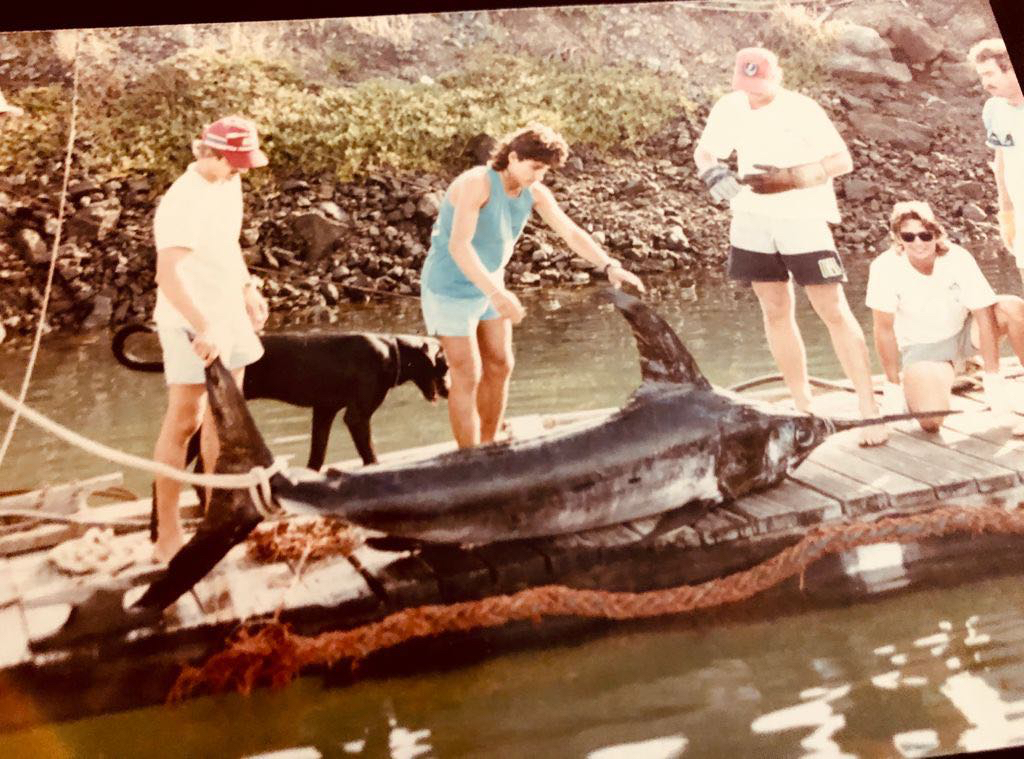 From left to right: Richard Chellemi, Rick Ruhlow, Rodger Munoz, and Captain Bubba Carter proudly display a magnificent swordfish caught off the coast of Flamingo, Costa Rica, in the vibrant fishing heydays of the 1980s