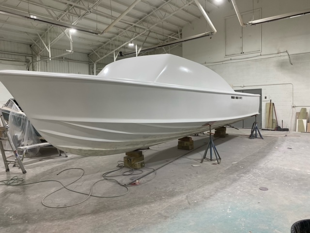 side image of a 31 bertram during the boat refit in progress
