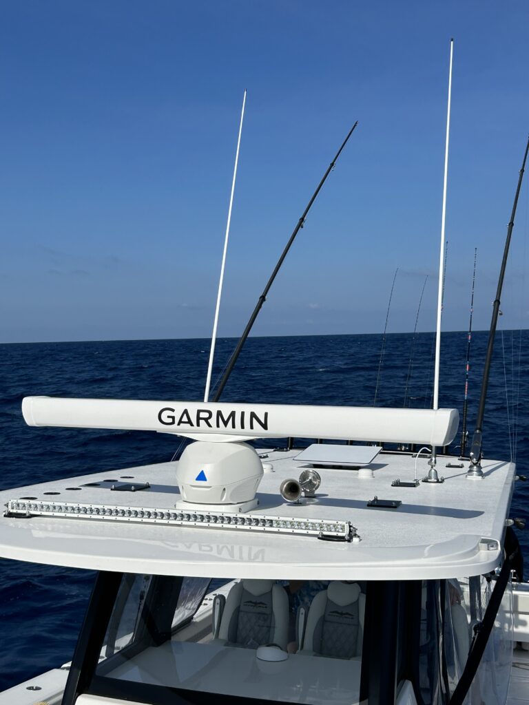 electronics for big cats: garmin open array radar on a t top of a catamaran.
