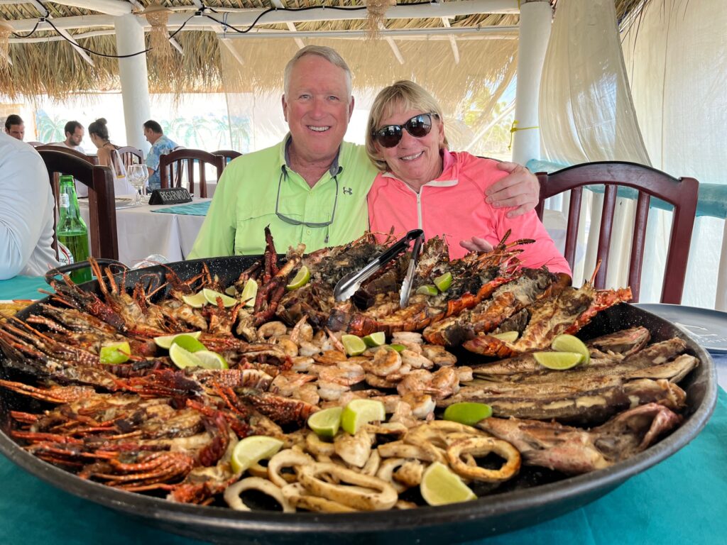 2 people enjoying Dominican Republic food on a Traveling Sportfish
