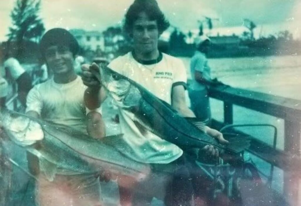 Ray holding a snook fish
