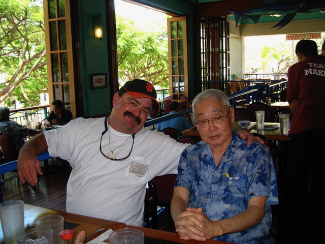 Lure maker Steve Coggin with Dentist Dr Park sitting at a restaurant 