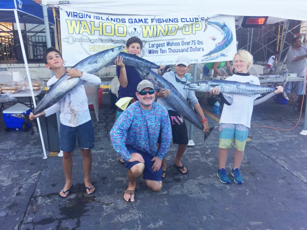 holding wahoo fish