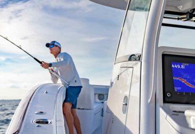 GSD™ 28 SONAR MODULE and a fisherman reeling in a fish