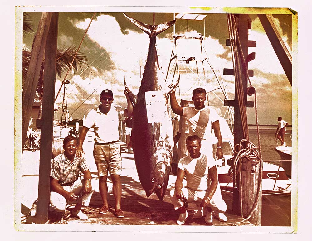 (L to R) Capt. Ben DeGutis, Bud Haddock, Capt. Pete Kemp, and mate Dick Griner in 1964 with a big tuna catch in the Bahamas.