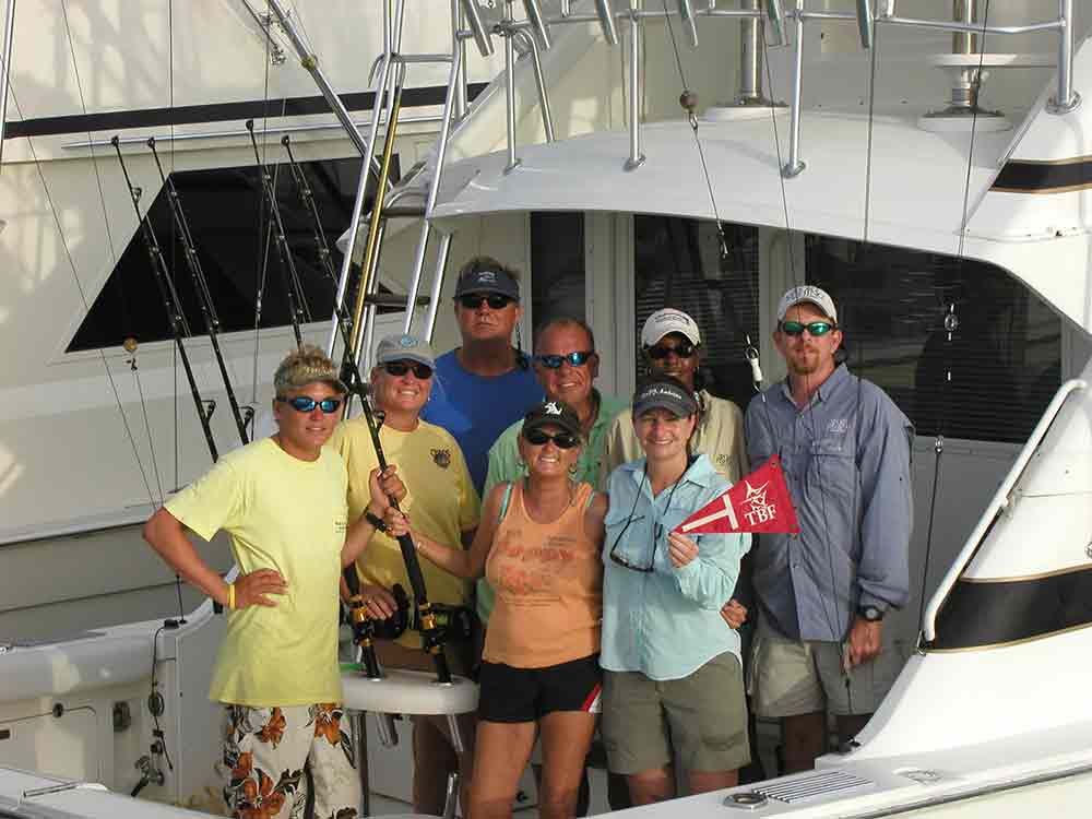 People in the back of a boat