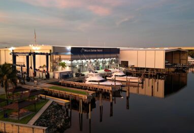 Willis Custom Yachts image of boatyard with glassy water around the docks