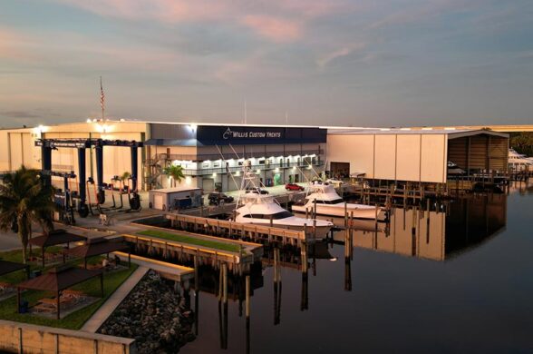 Willis Custom Yachts image of boatyard with glassy water around the docks