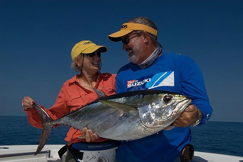 Captain RT Trosset and Poppy Brownlee with a tuna fish