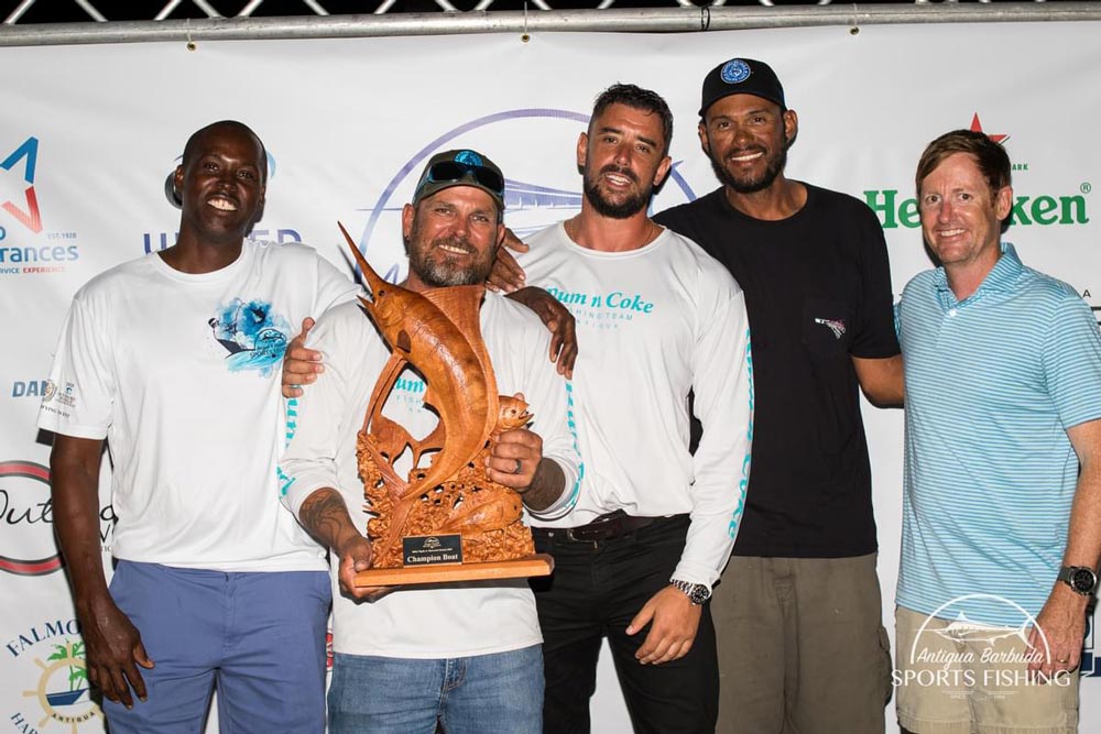 men holding fishing trophy