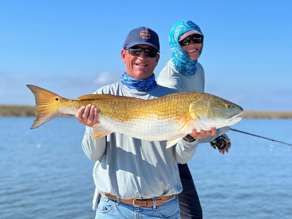 Captain Arch Bracher holding up a nice golden redfish