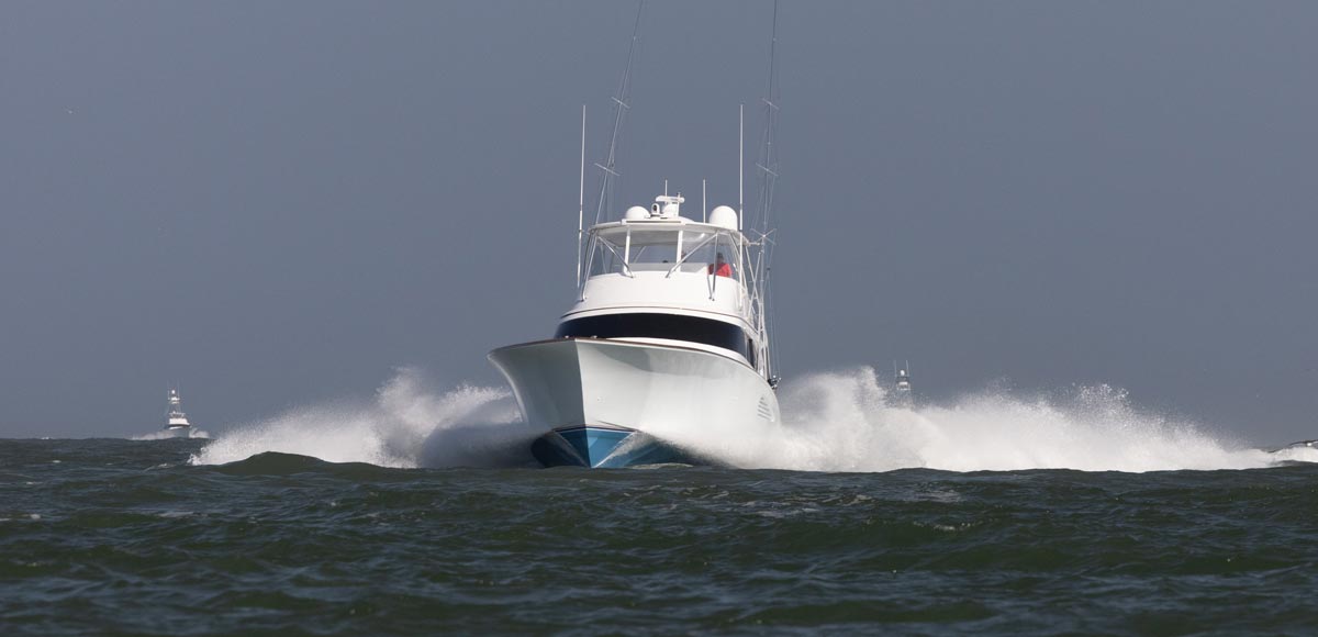 a white sportfish boat running on the ocean for an article on design loads