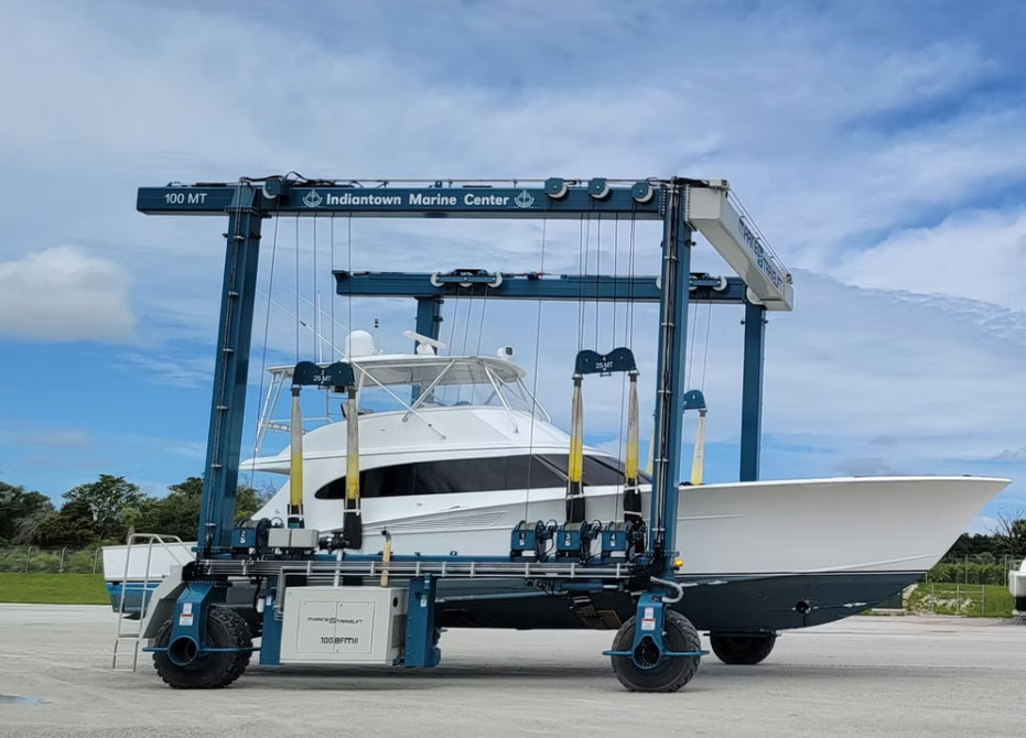 a boat in a Indiantown Marine Center lift