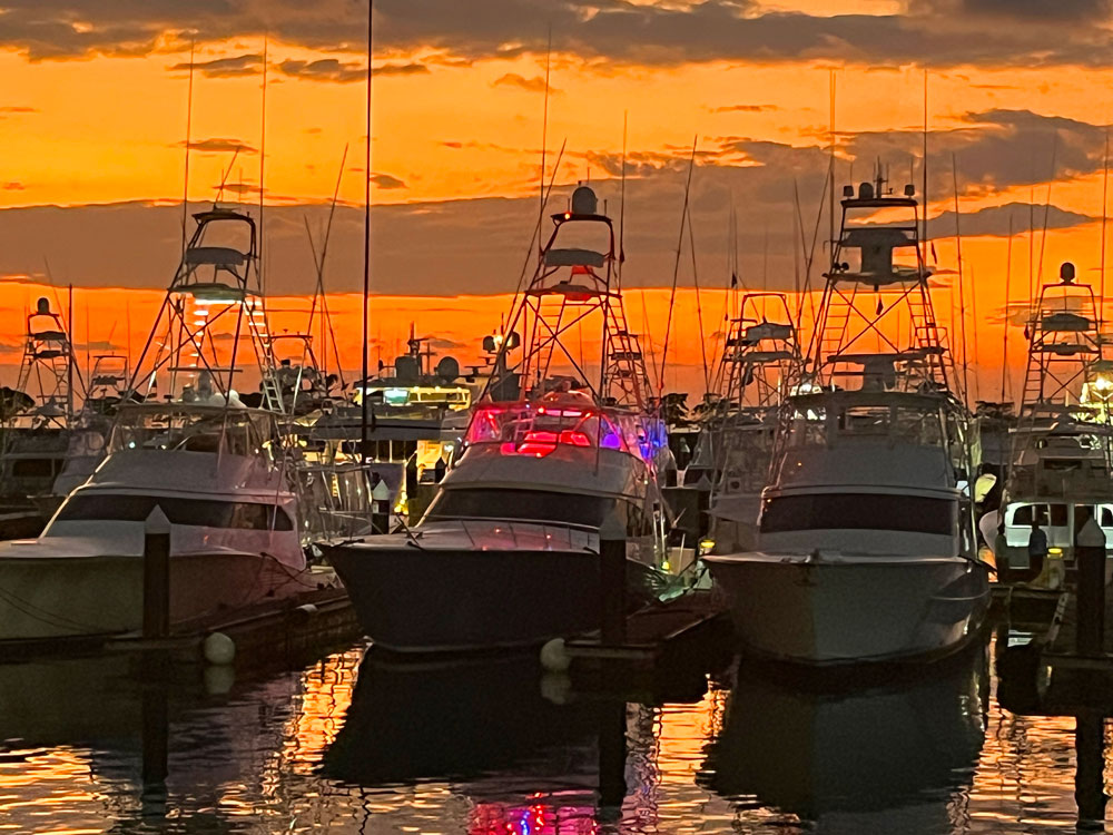 sunset over the marina with an orange sky
