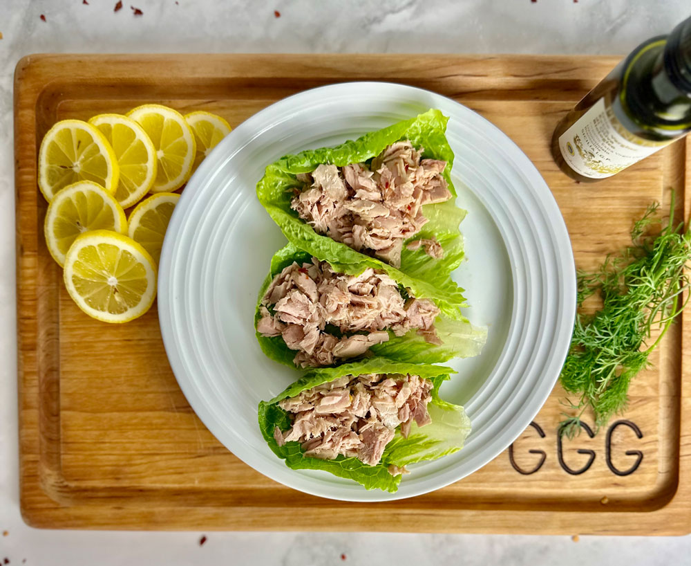 skip the can keep the catch tuna conserva story with this image of the tuna on a plate with lemons