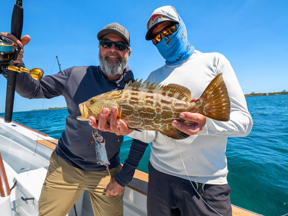 2 guys and a grouper fish