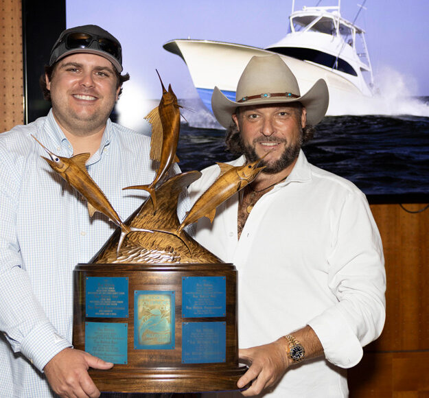 Captain of the Year Phillip Fender left and the boats owner right