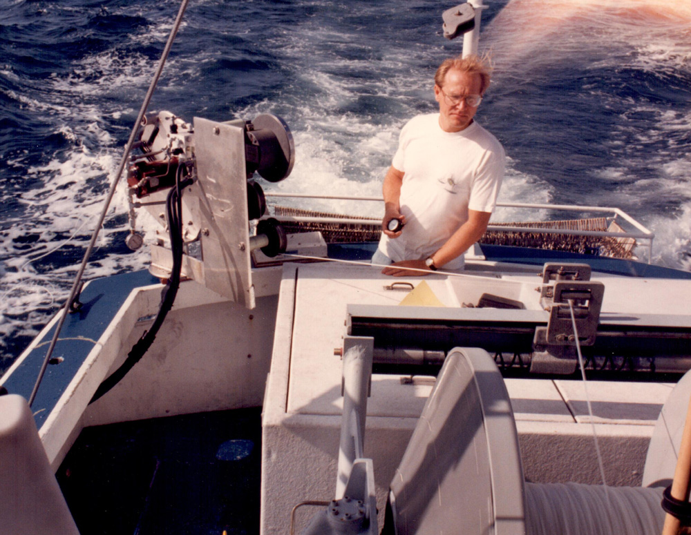 a man in the back of the boat