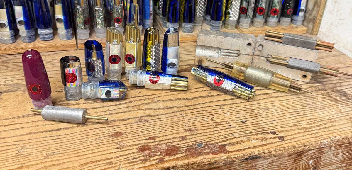 Gary S. Yamamoto and the Magic Behind Hawaii’s Bucket Lure showing a display of lures on a bench