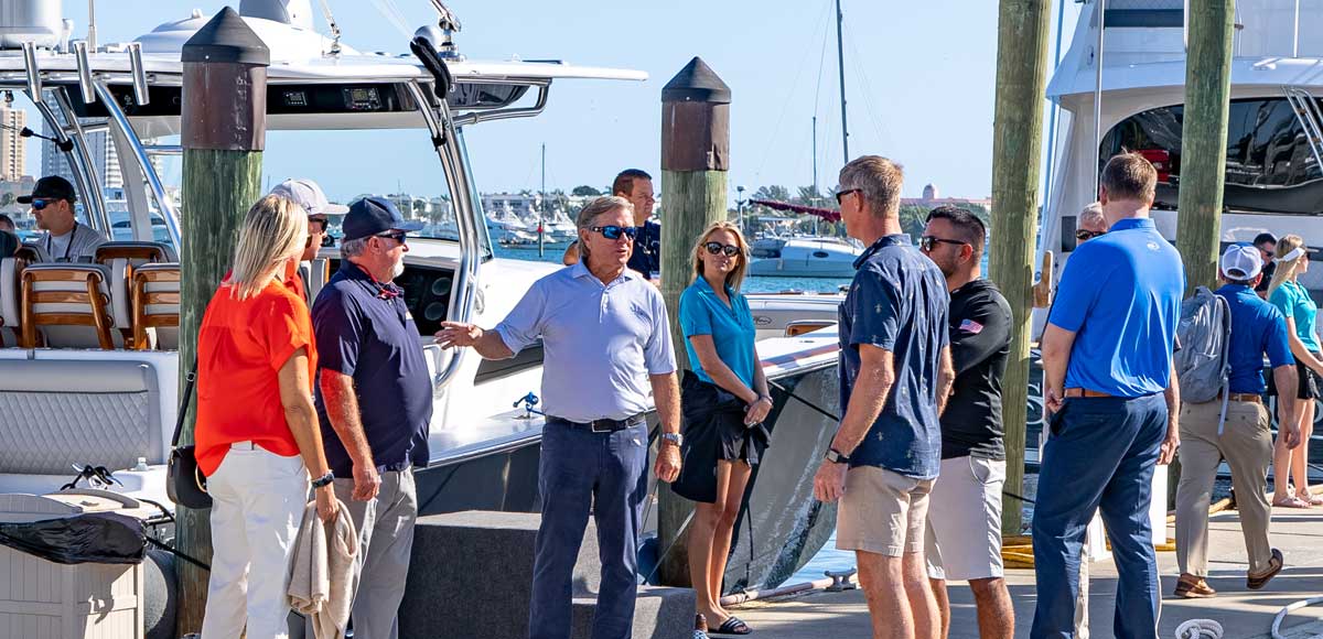 Pat Healey IGFA Hall of Fame inductee speaking with people on a dock