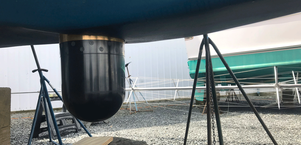 a boat sonar extended from the bottom of the boat on land