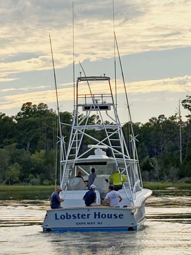 a boat on the water idling along