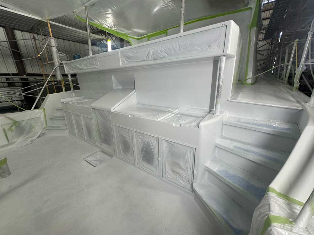 a freshly painted aft section of a boat in white paint