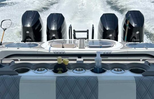 modern outboard quads on the boack of the boat running on the ocean