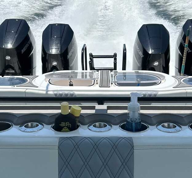 modern outboard quads on the boack of the boat running on the ocean