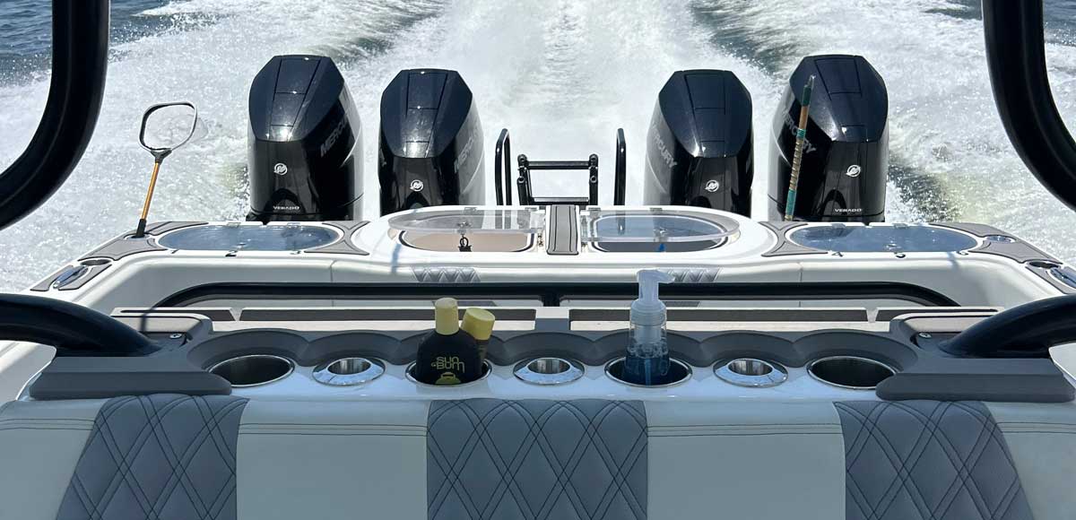 modern outboard quads on the boack of the boat running on the ocean