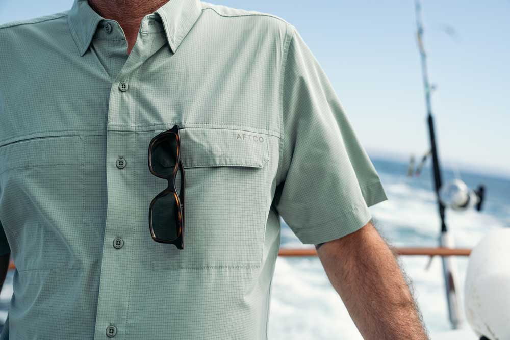 shirt with sunglasses in the pocket