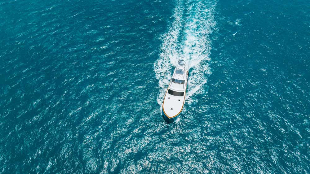 a boat powered with Cat Marine Engines seen from a drone overhead