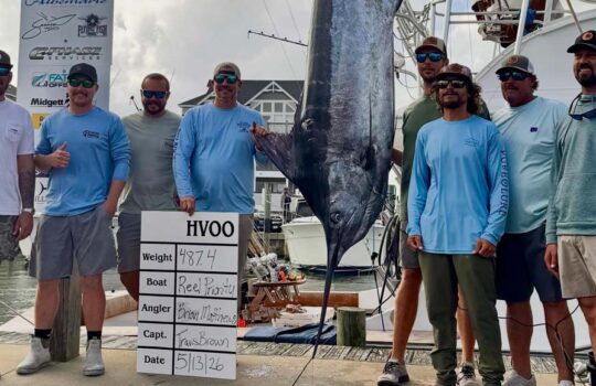 Captain Travis Brown and the reel priority crew with winning blue marlin 487.4 lbs