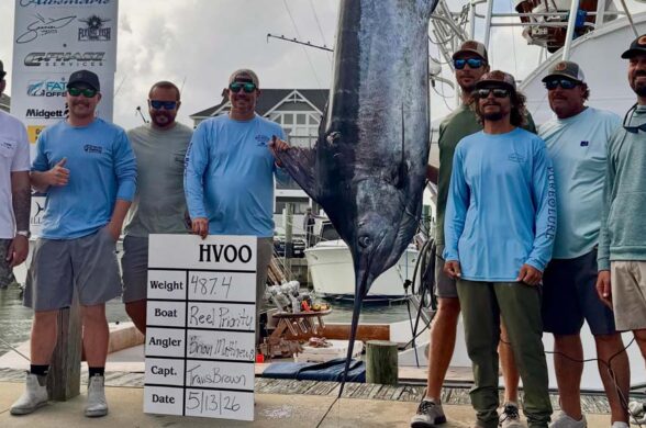 Captain Travis Brown and the reel priority crew with winning blue marlin 487.4 lbs