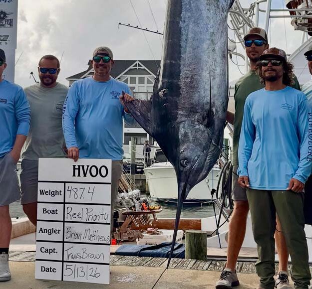 Captain Travis Brown and the reel priority crew with winning blue marlin 487.4 lbs