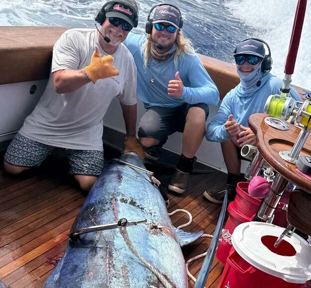 Captain Johnathan Henry crew with winning marlin in the boat