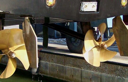 rudder design showing two gold propellers
