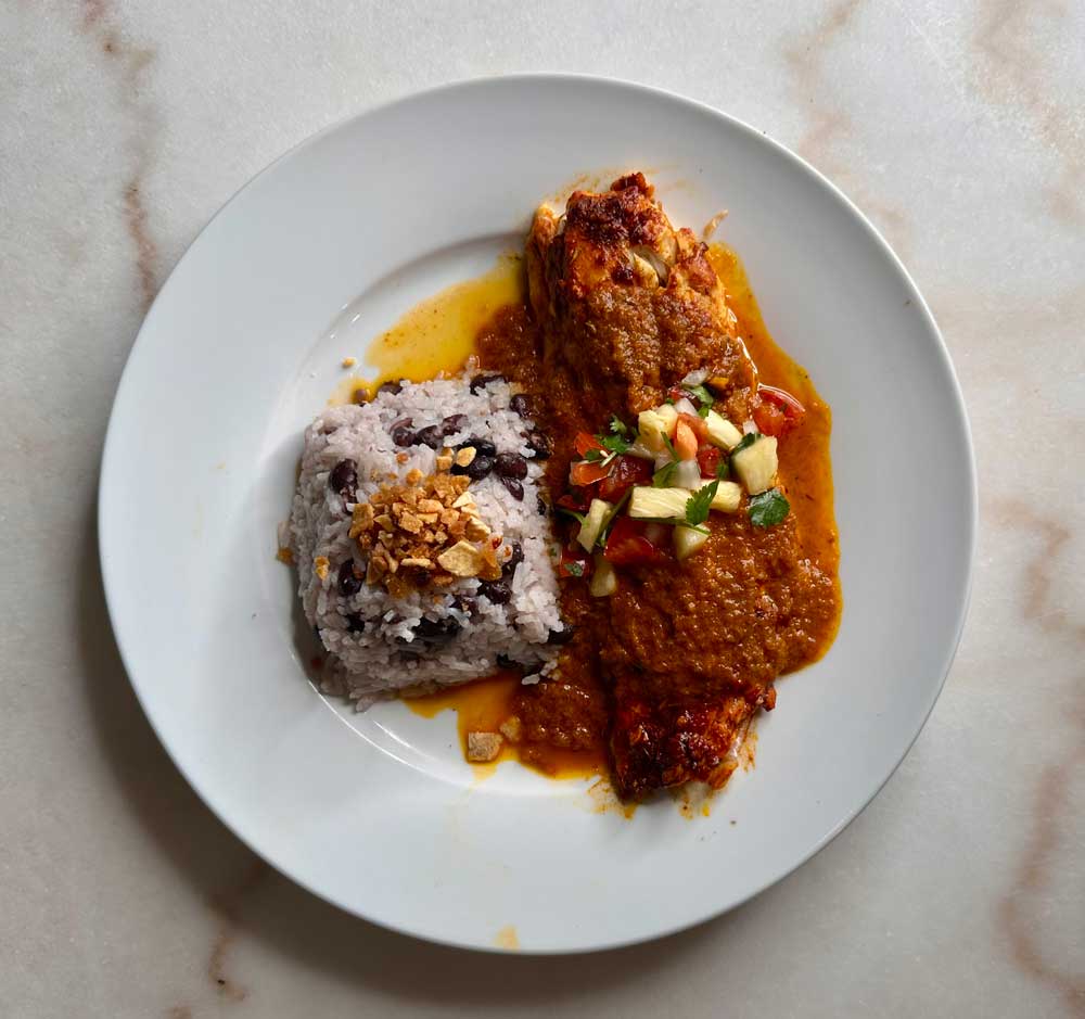 Belize Fly Fishing and a Caribbean-Inspired Redfish Recipe on a plate with white rice