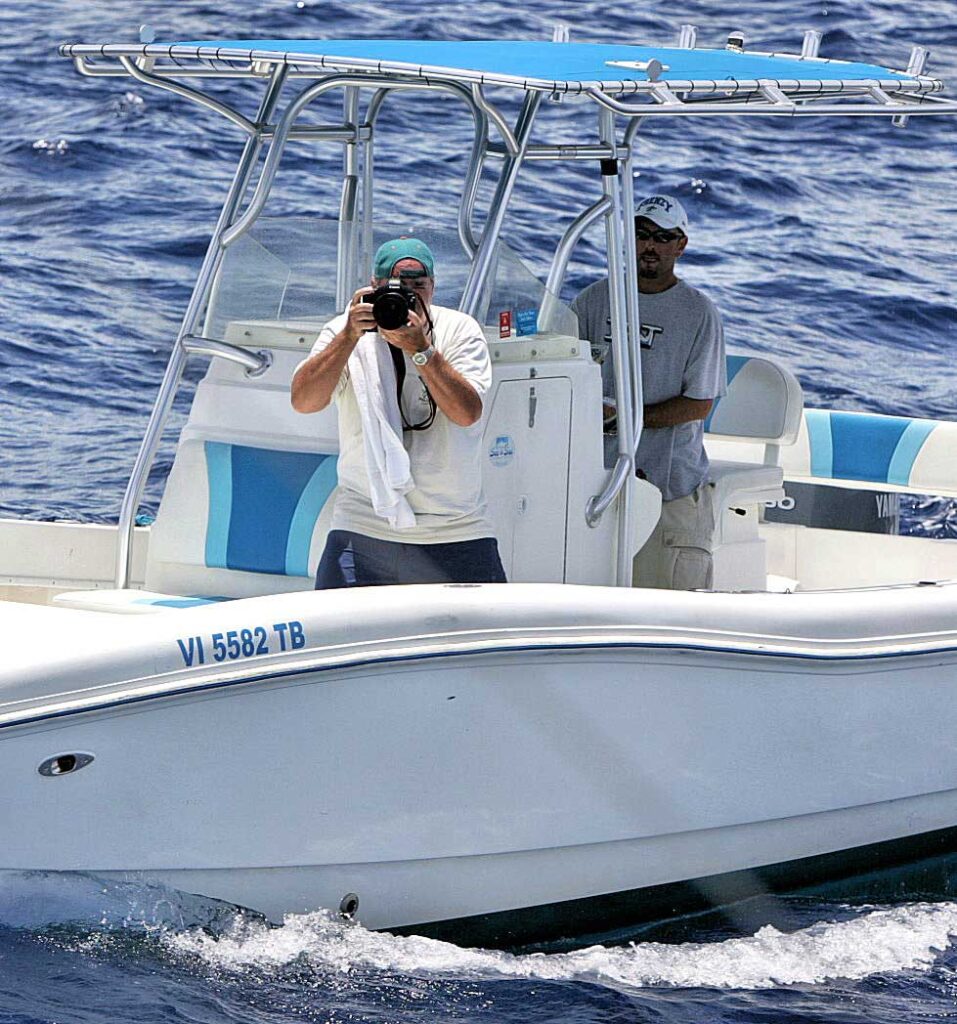 Richard Gibson photographing from a boat