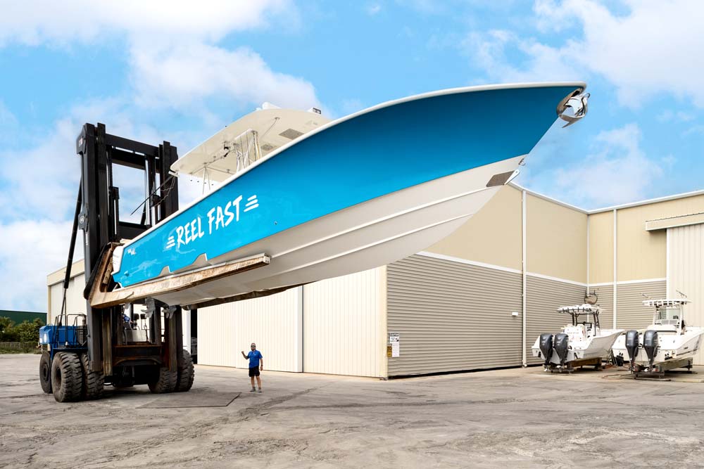 blue boat on a marine forklift